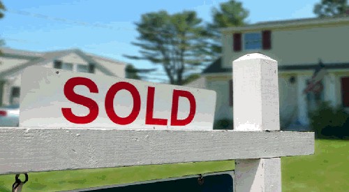 Sold sign in front of a home